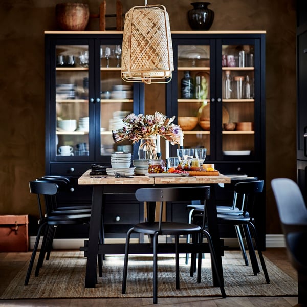 An acacia/black SKOGSTA dining table in the dining room