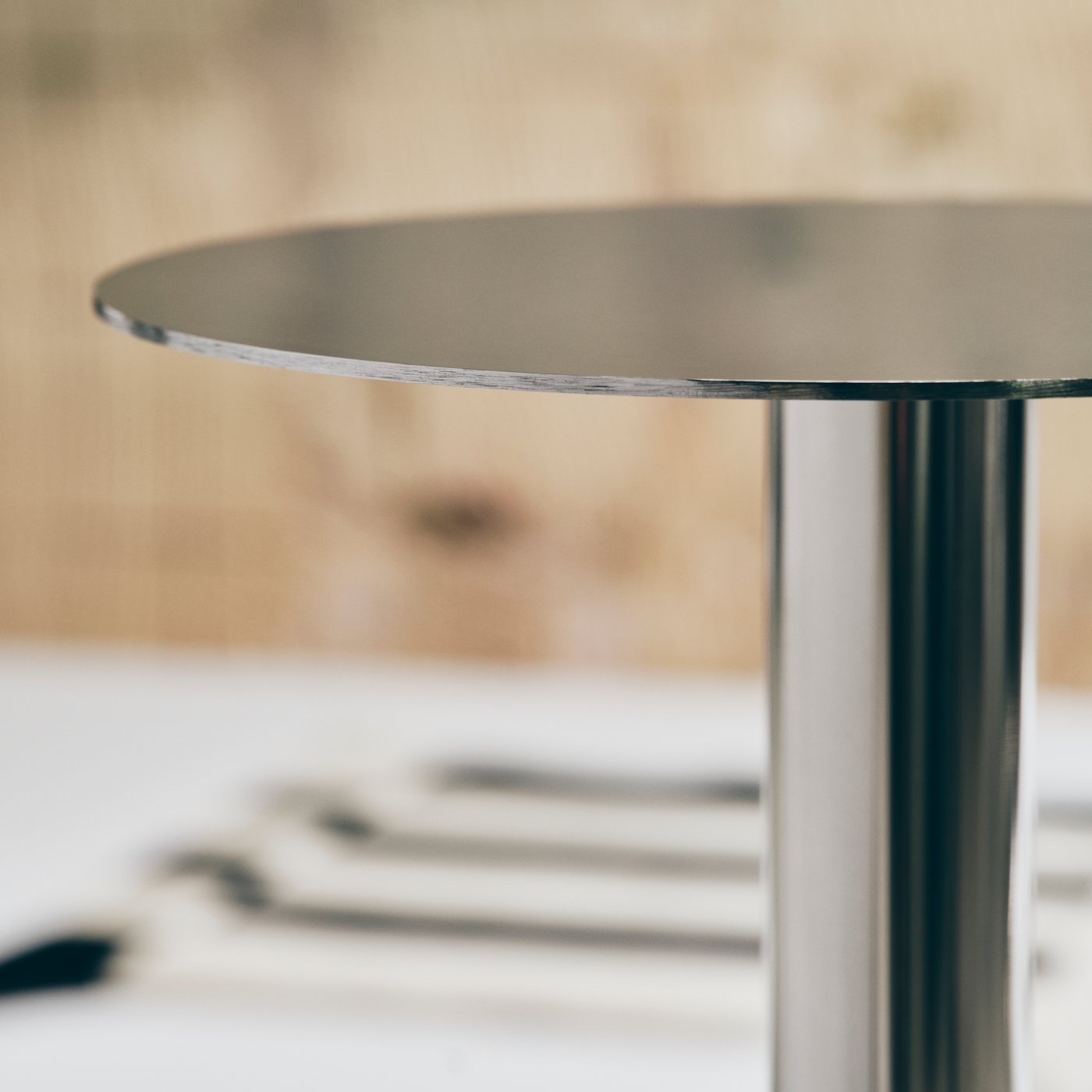 Close up of a metallic table top from a table that Emanuele Stamuli designed for IKEA art collection called KONSTRUNDA.