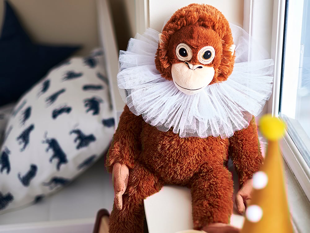 An orangutan DJUNGELSKOG soft toy in the childrens room.