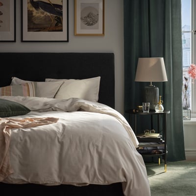 A light grey-beige ÄNGSLILJA duvet cover and pillowcase