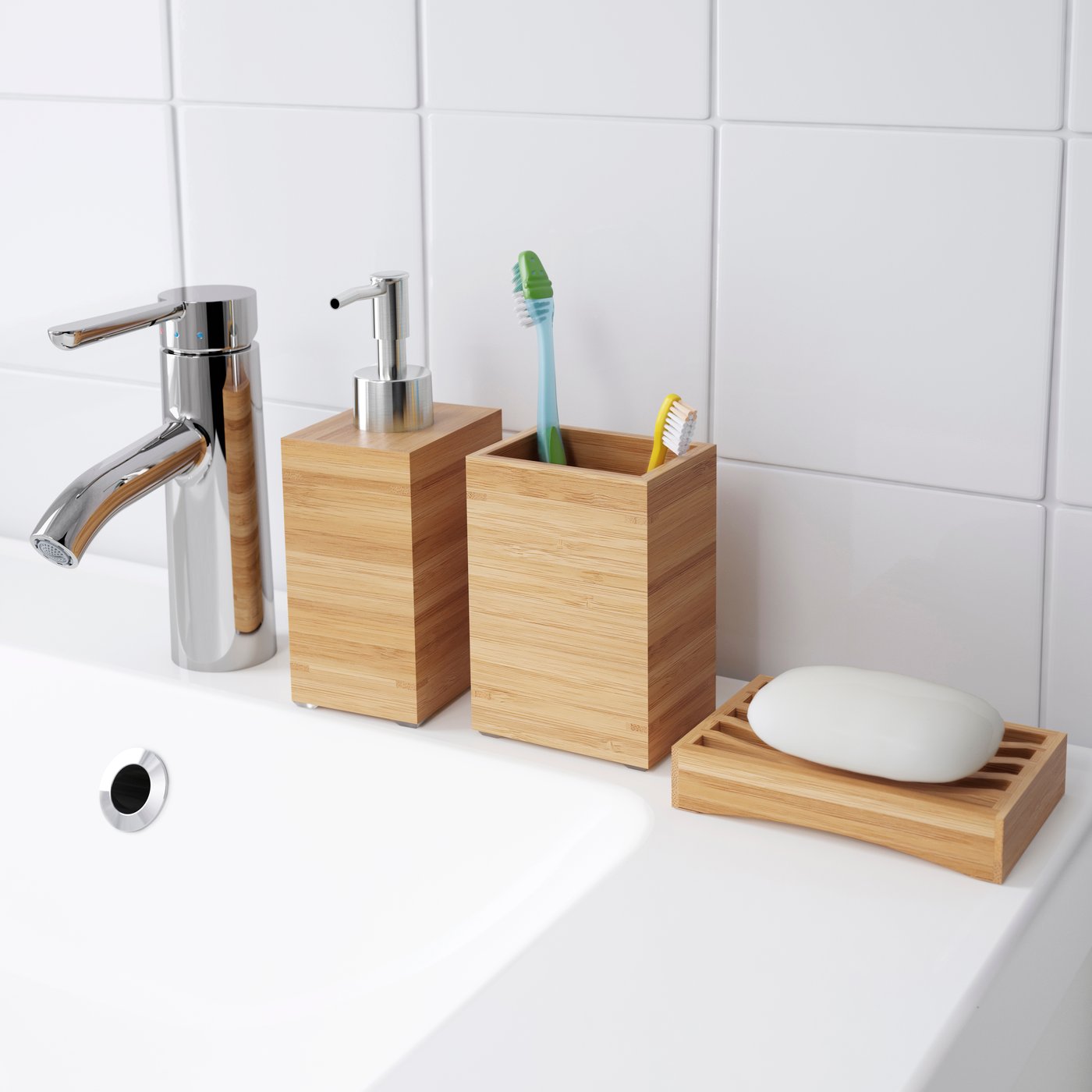 A bathroom shelf with a pump bottle, a container with toothbrushes, and a light‑wood soap dish on the edge of a white sink.