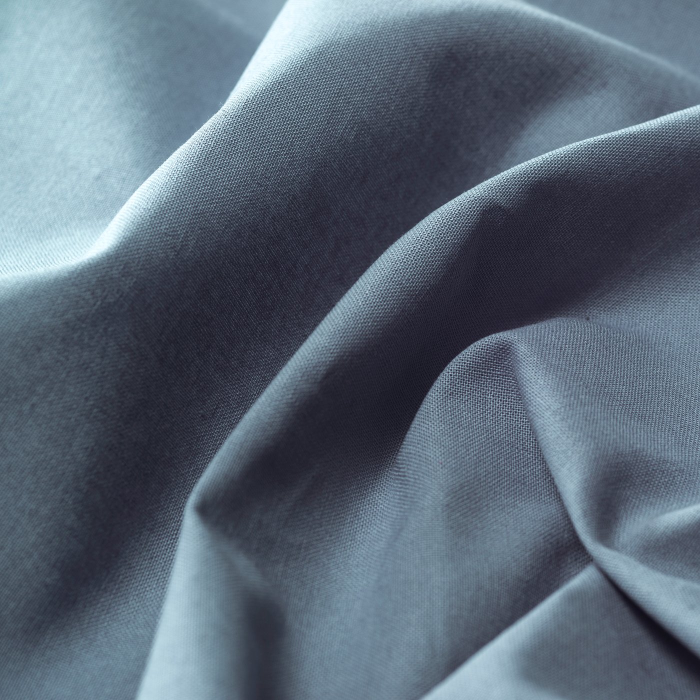 A light blue DITTE curtains with tie-backs, 1 pair in the living room