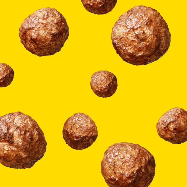 Man sieht einen gelben Hintergrund und Fleischbällchen fallen herunter.