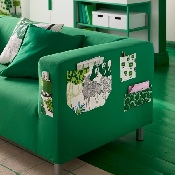 A green GURLI cushion cover in the living room