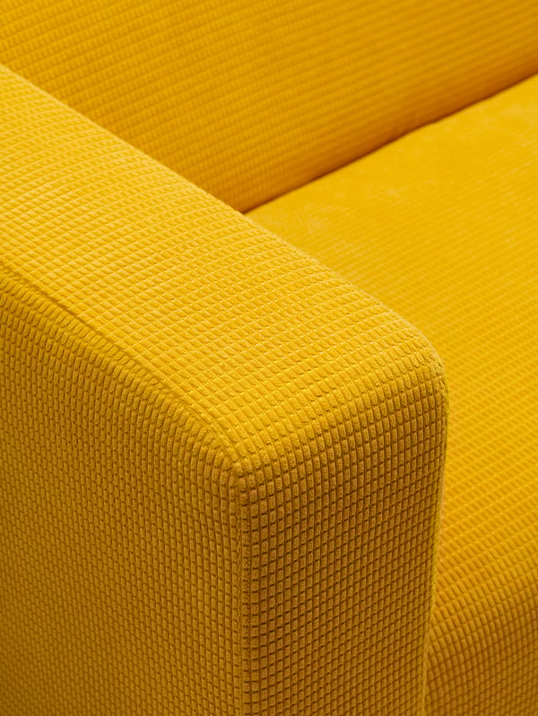 A Vansbro yellow KLIPPAN cover for 2-seat sofa
