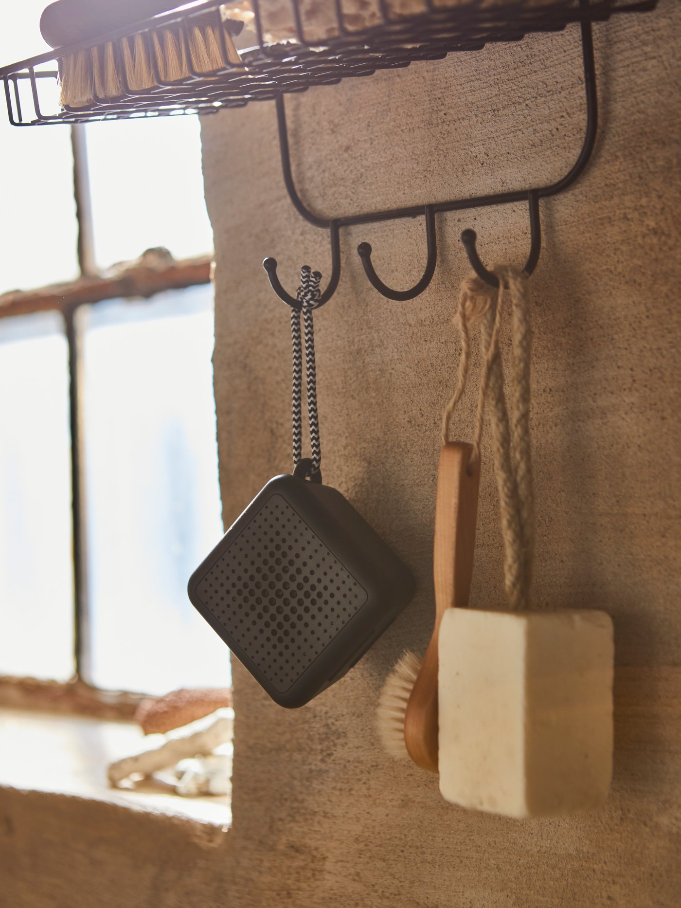 A waterproof/black VAPPEBY portable bluetooth speaker