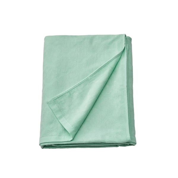 A turquoise JÄTTETUJA blanket in the NA