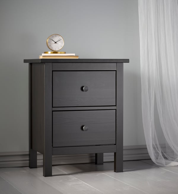 A brass-colour GÄNGA alarm clock in the bedroom