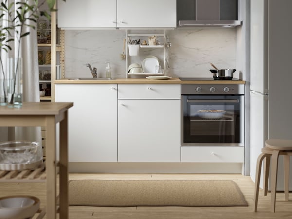 A stainless steel MATÄLSKARE wall mounted extractor hood in the kitchen.
