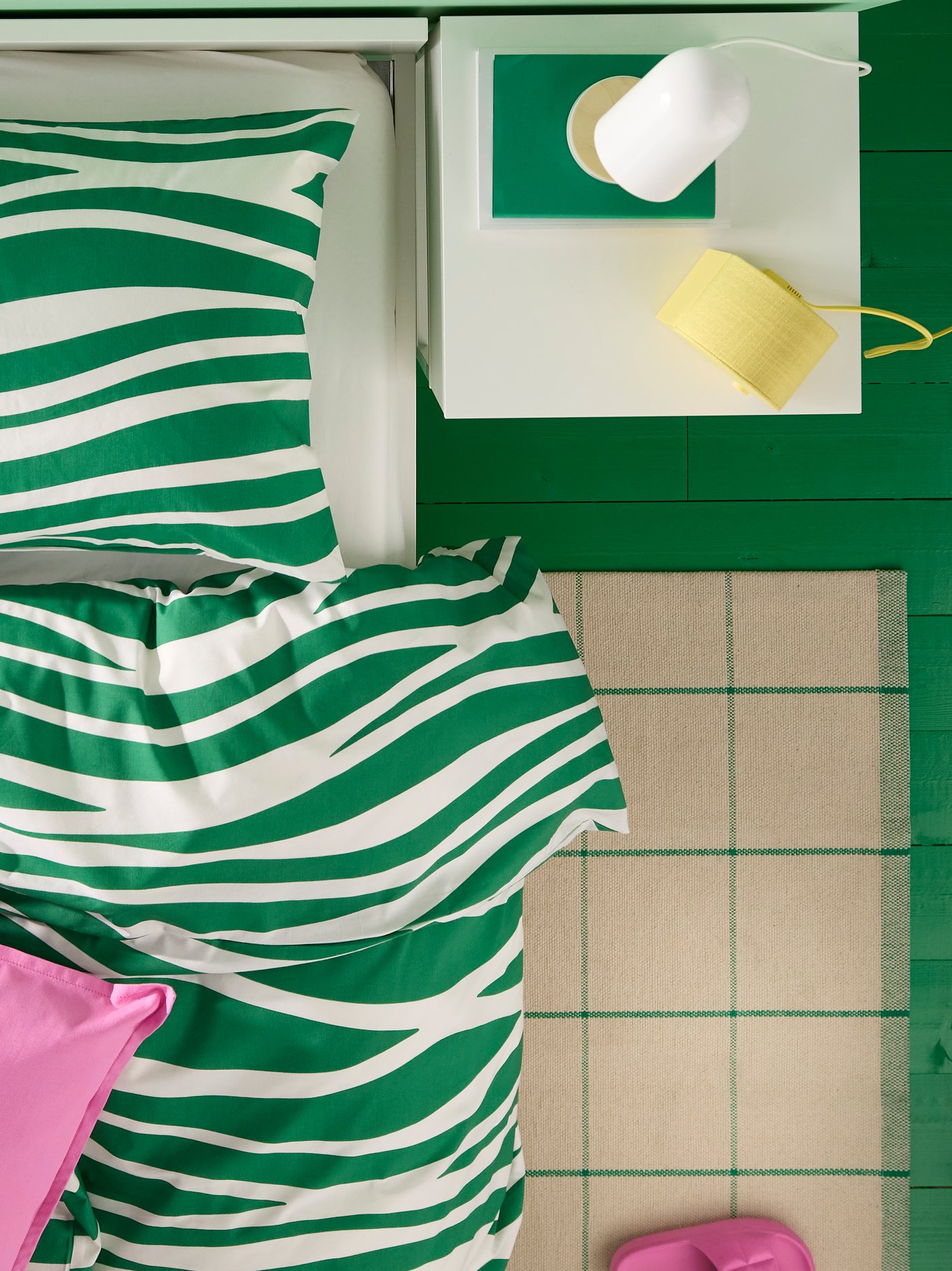 A white VIKHAMMER bedside table in the bedroom