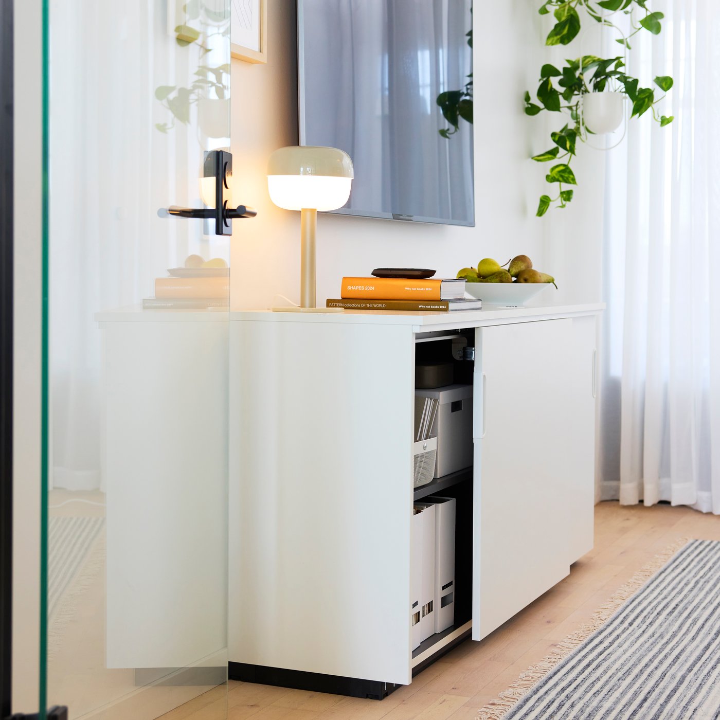 A white GALANT cabinet with sliding doors