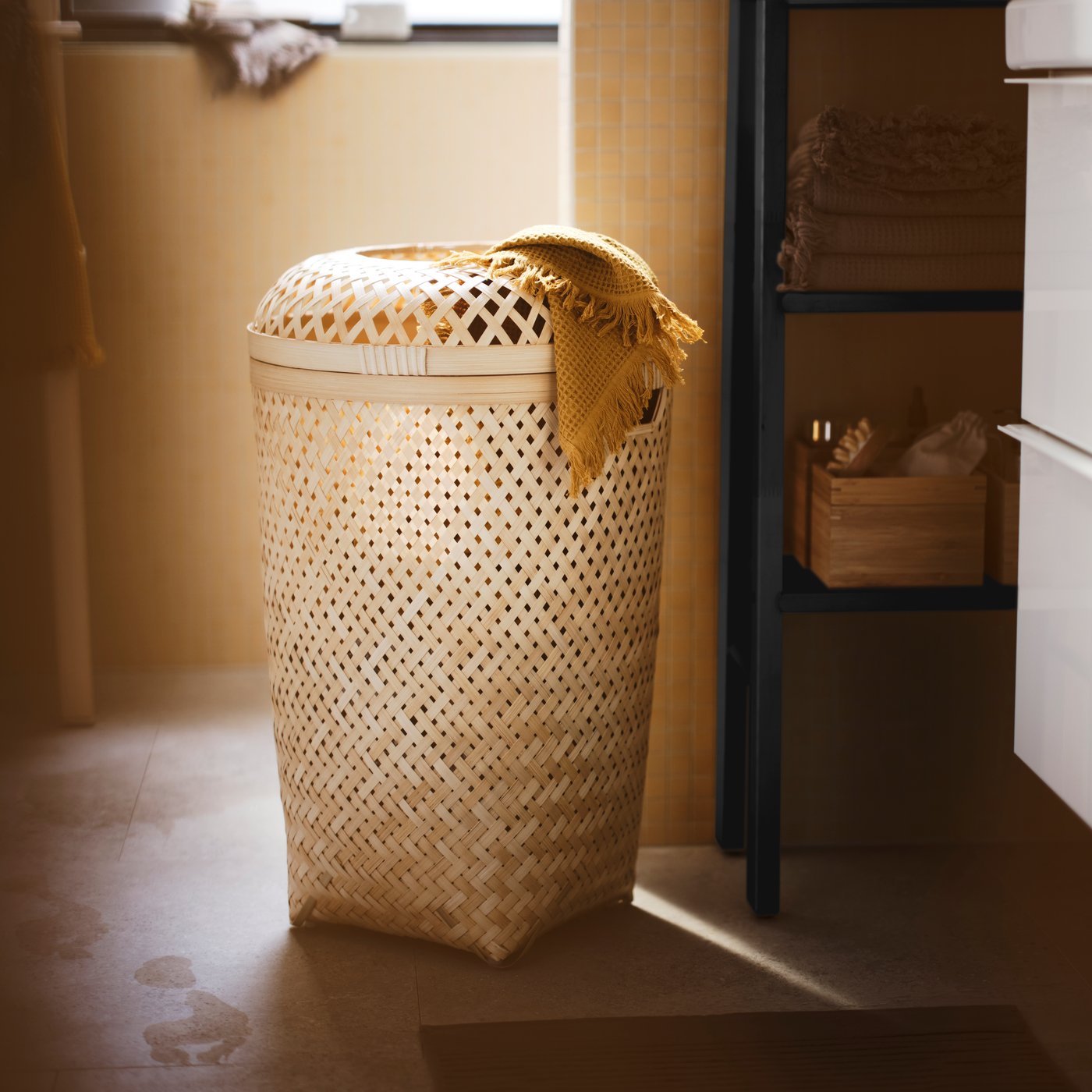 A handmade bamboo SALUDING laundry basket