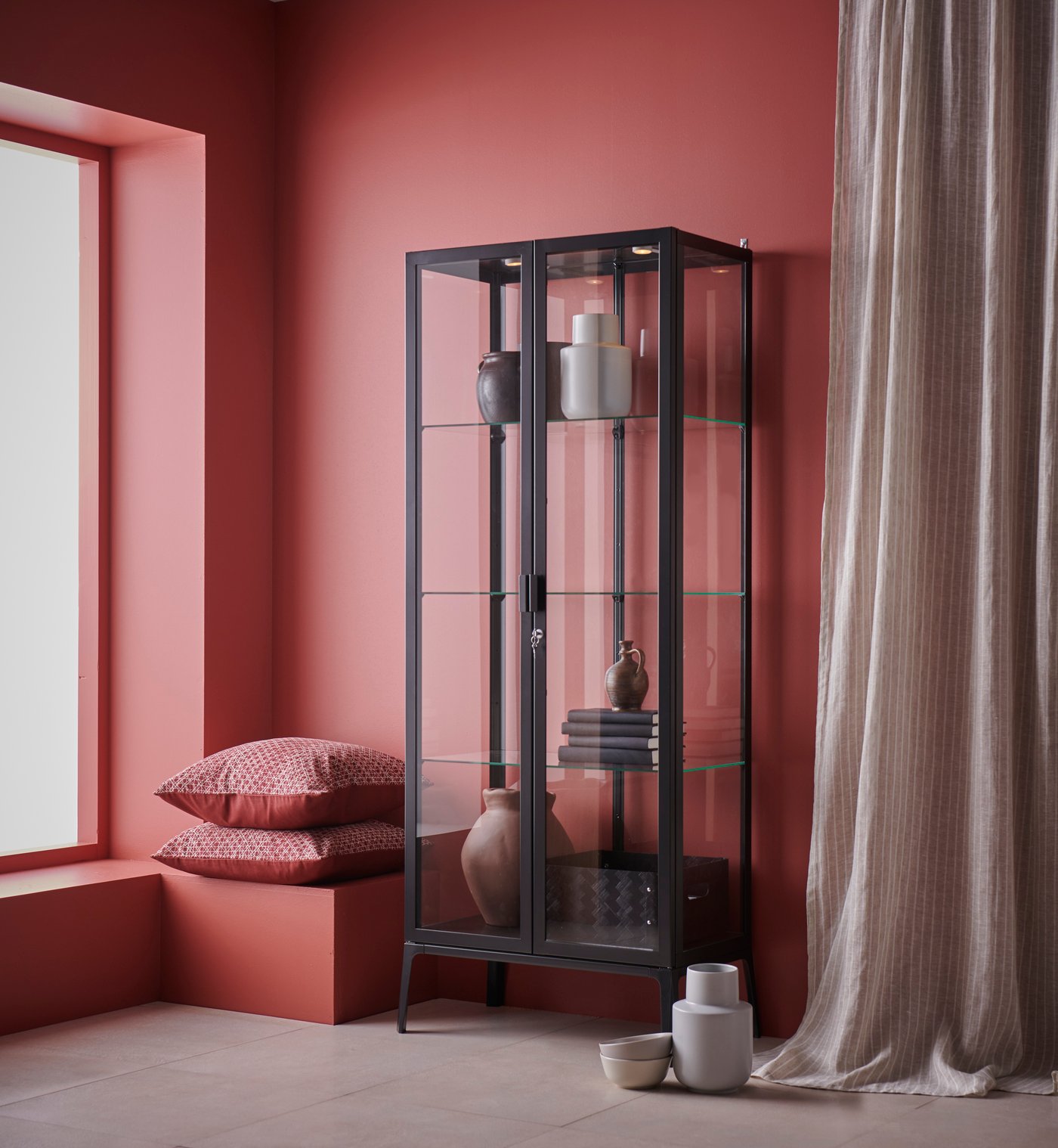 An anthracite MILSBO glass-door cabinet