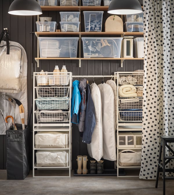 A storage area with clothing storage, SAMLA drawers and SKUBB storage range.