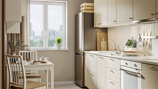 An IKEA 500 freestanding/black stainless steel MEDGÅNG fridge/freezer