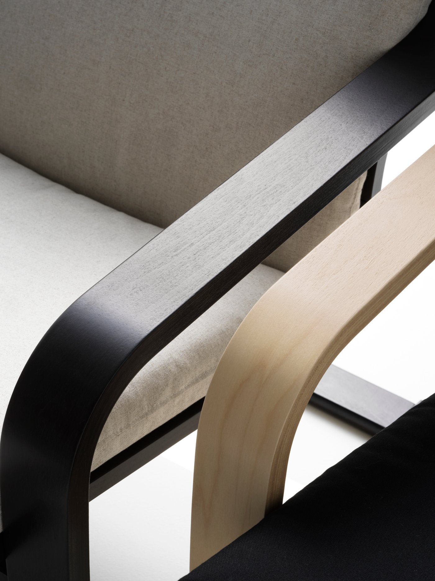 A natural colour/beige/Vissle black POÄNG low-back armchair in the NA