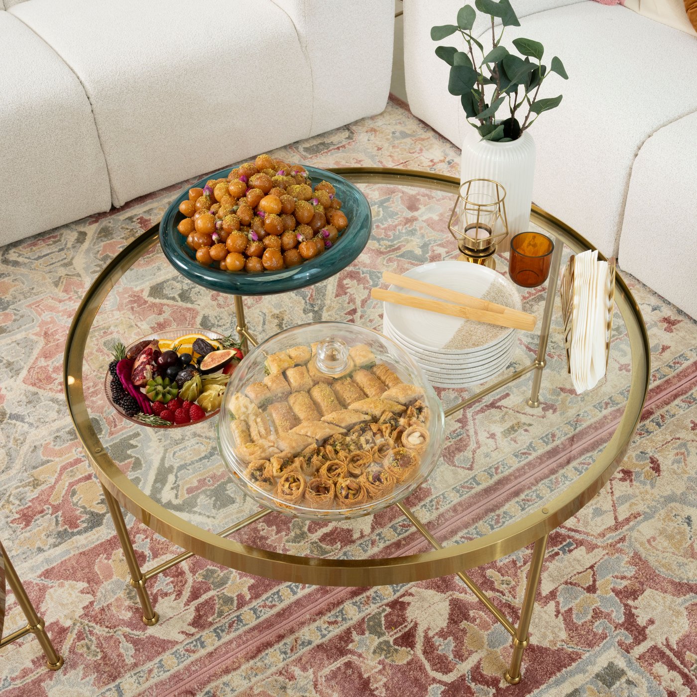 A gold effect/glass TORSJÖ coffee table in the living room
