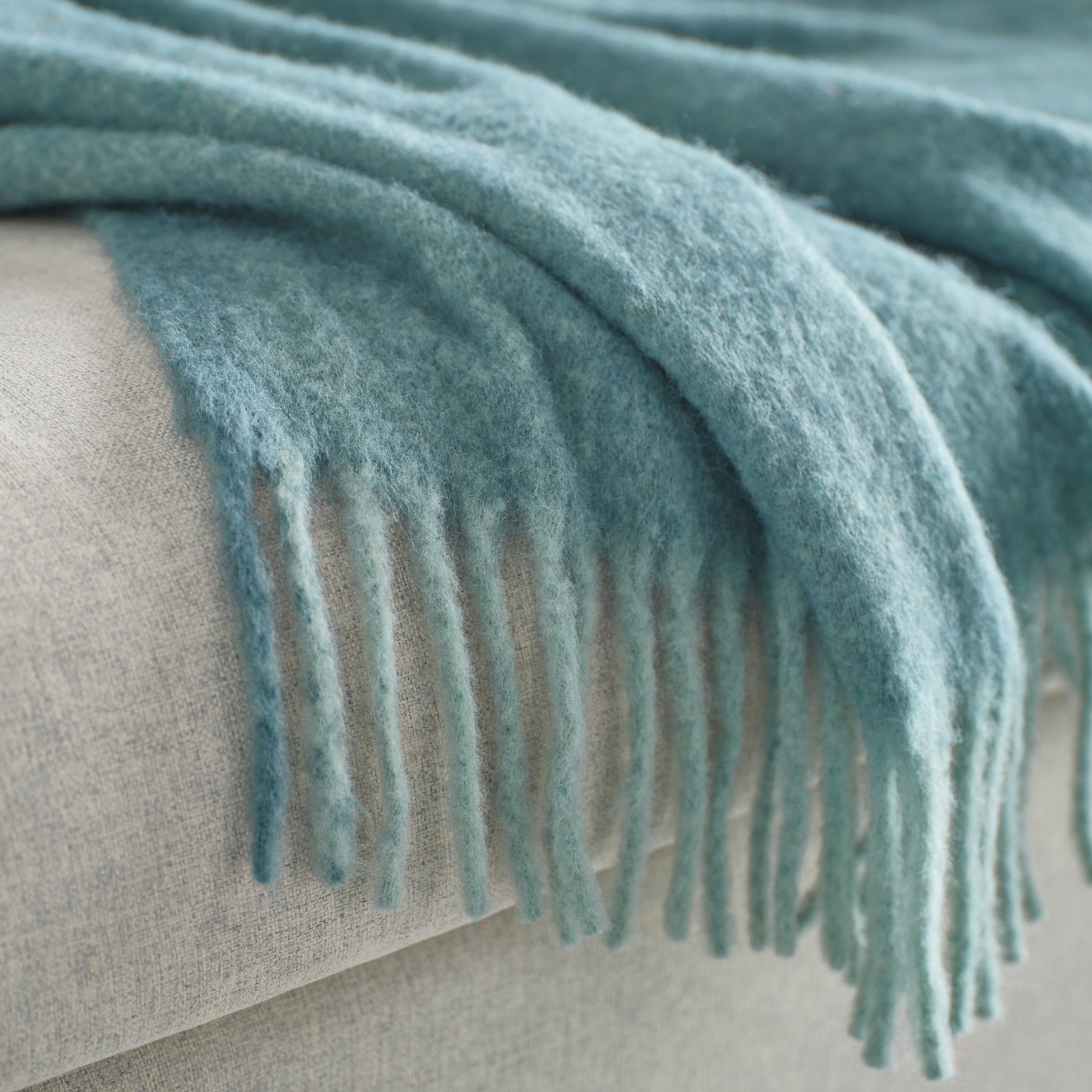 A grey-turquoise KLIPPOXEL throw