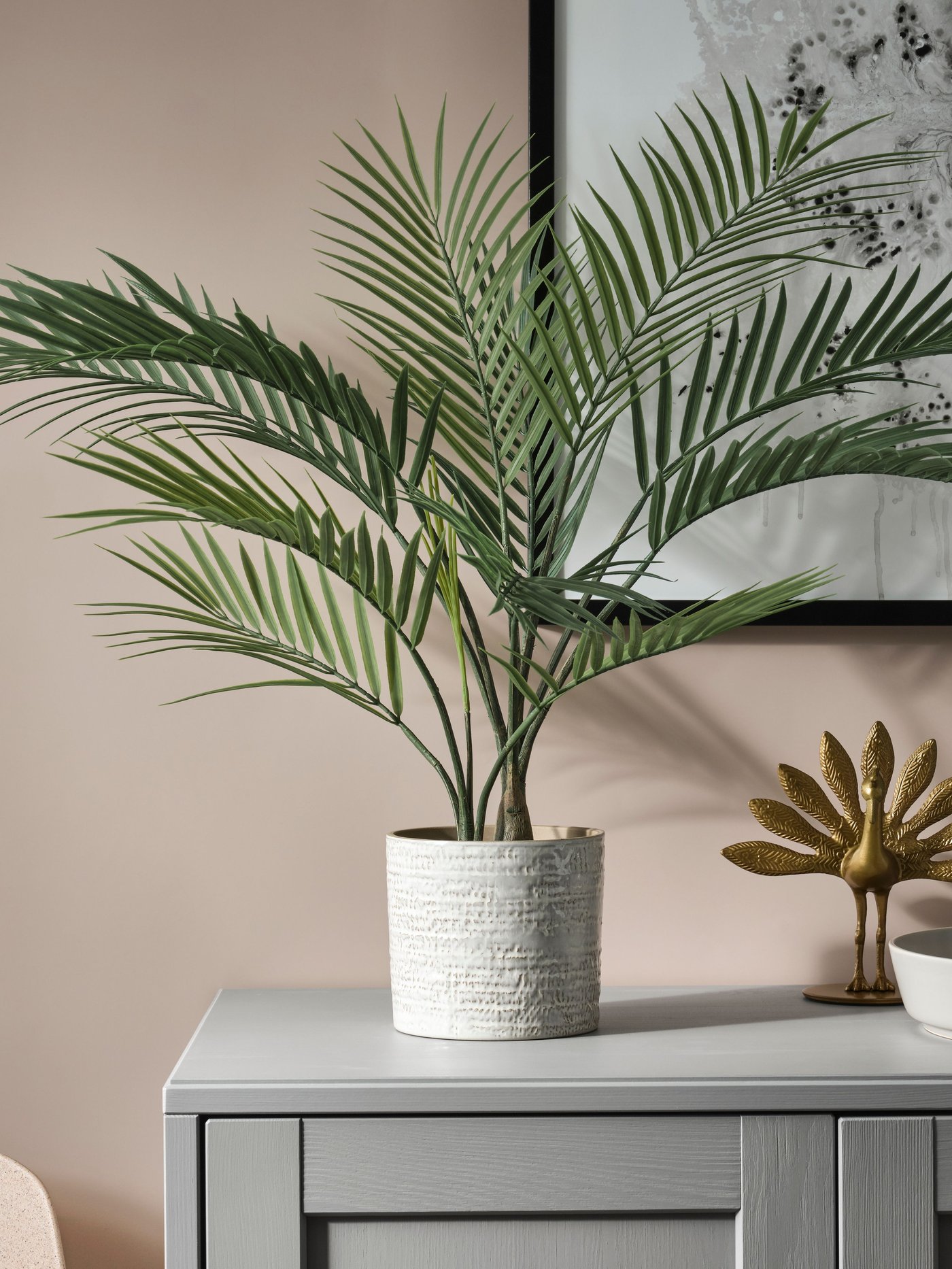 Planta artificial dins d'un test FEJKA de palmera areca per a interior/exterior