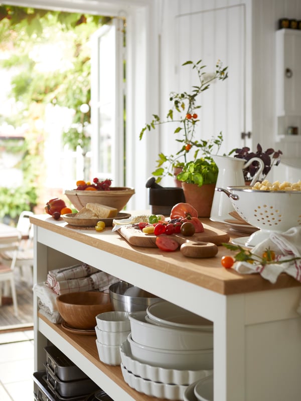 An off-white/oak TORNVIKEN kitchen island