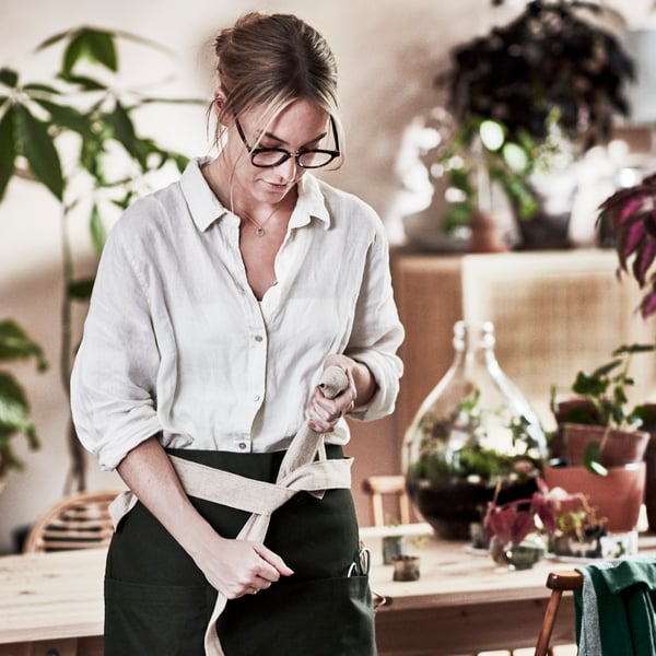 A dark green/handmade BOTANISK apron
