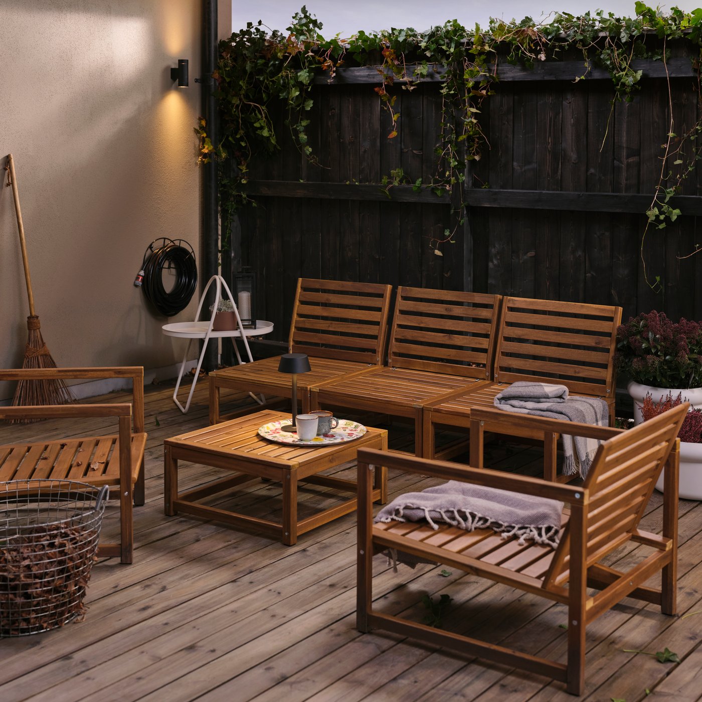 A NÄMMARÖ 4-seat conversation set stands next to a NÄMMARÖ seating section for modular sofa, used as a coffee table.