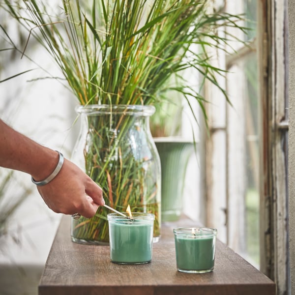 A Fresh grass/light green HEDERSAM scented candle in glass