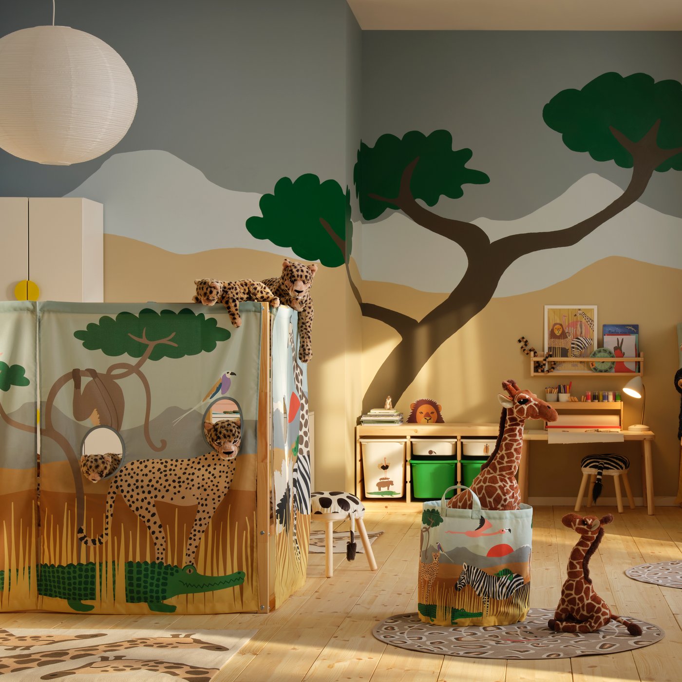 A multicolour/animals on the savannah KURA bed curtain in the childrens room