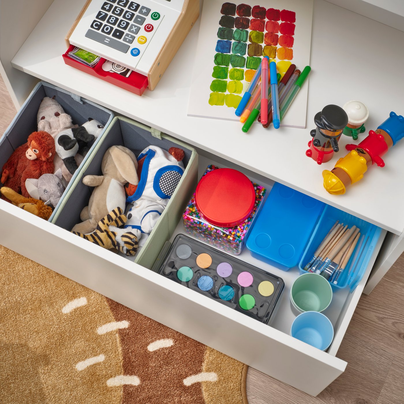 A white BERGIG book display with storage