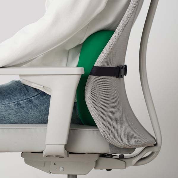 A green LÅNESPELARE lumbar cushion