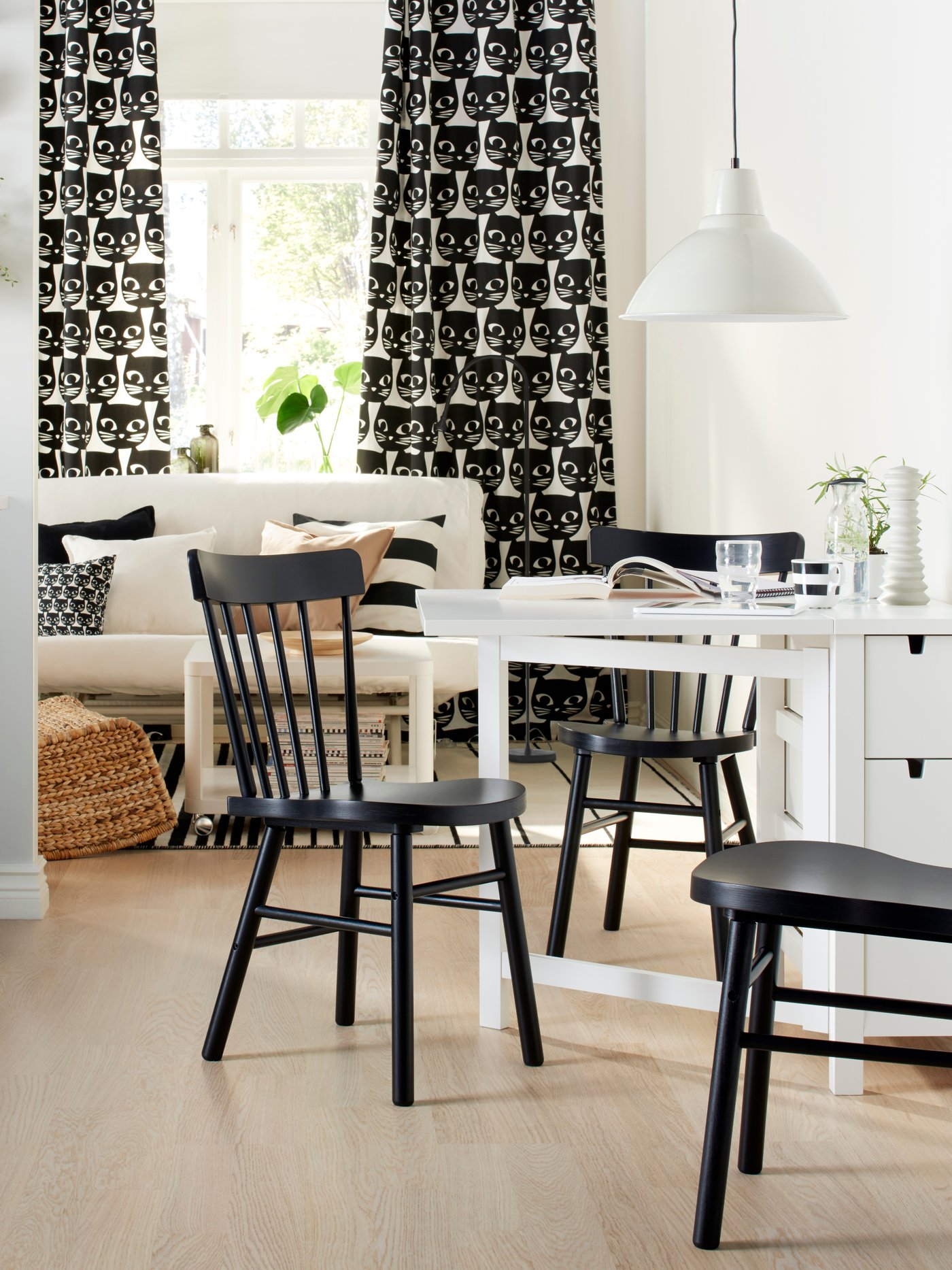 A black NORRARYD chair in the kitchen