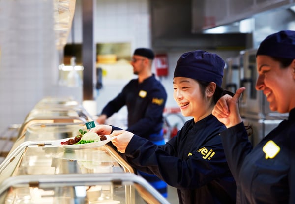 IKEA Food co-worker serving customers at the Swedish Restaurant