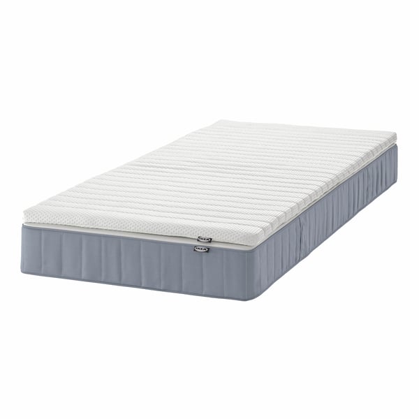 A firm light blue/Nisseholm white VESTERÖY mattress and mattress pad