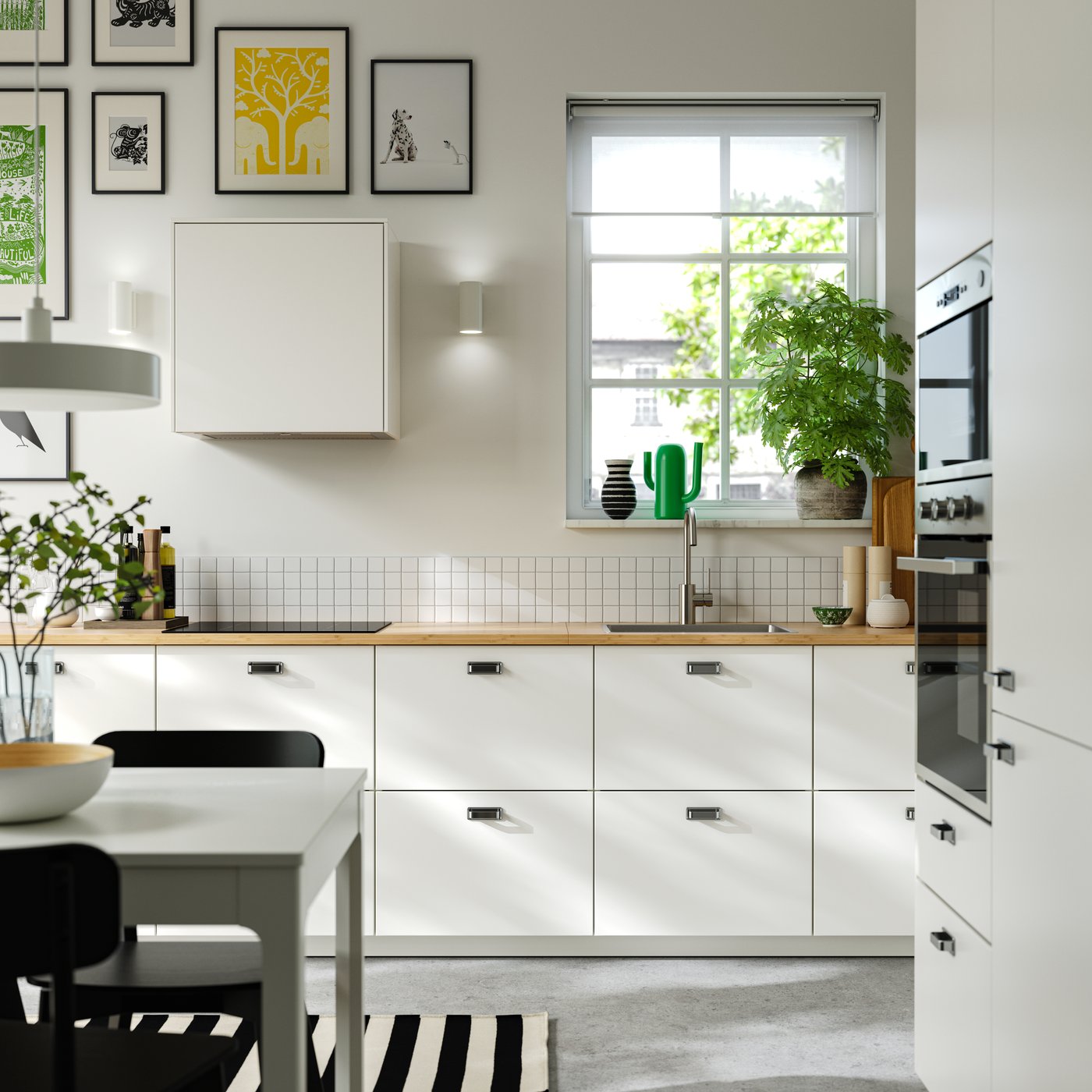 A wireless dimmable white spectrum/white NYMÅNE LED pendant lamp in the kitchen