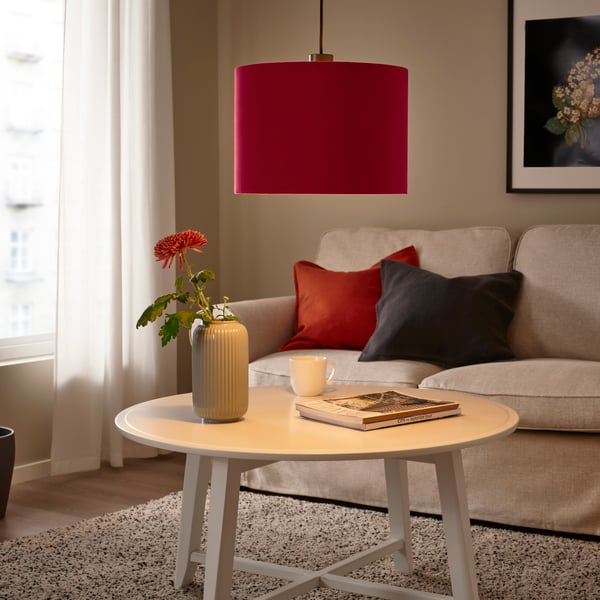 A dark red velvet MOLNSKIKT lampshade