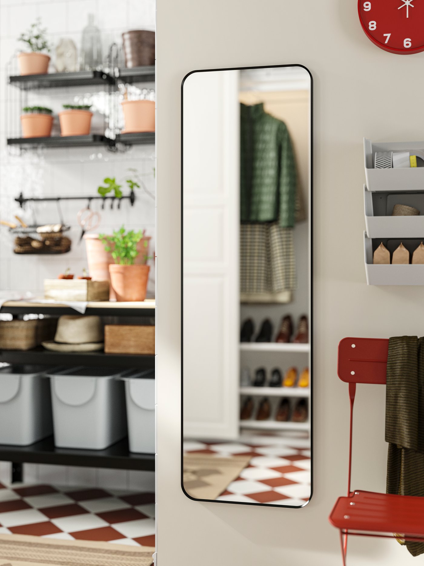 LINDBYN mirror on the wall, mirroring the opposite side of the hallway. A work bench in the back, a red chair by the side.