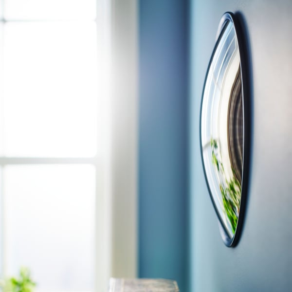 A black SVARTBJÖRK decorative convex mirror