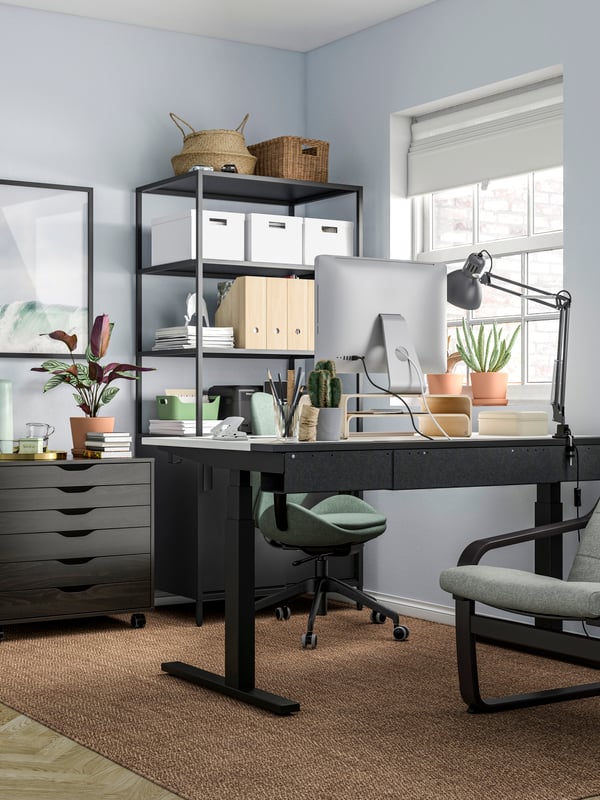 An electric white/black MITTZON desk sit/stand
