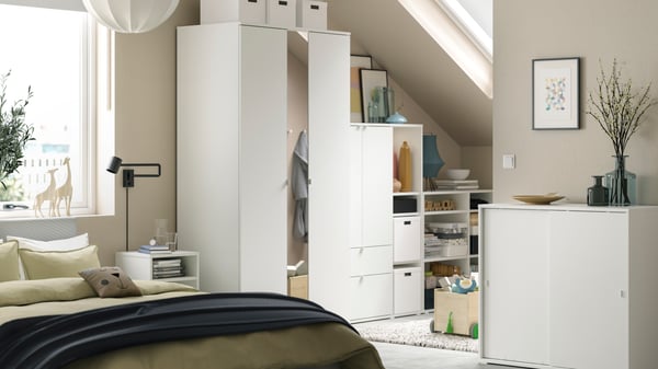 A white VIHALS cabinet with sliding doors