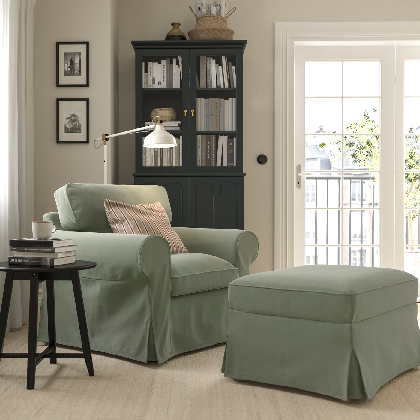 A Hakebo grey-green EKTORP armchair