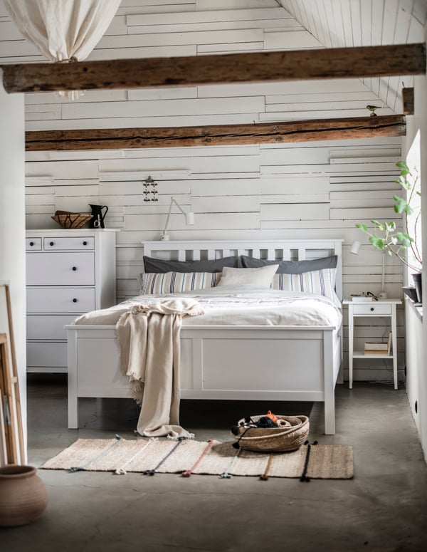 A white stain HEMNES bedside table.