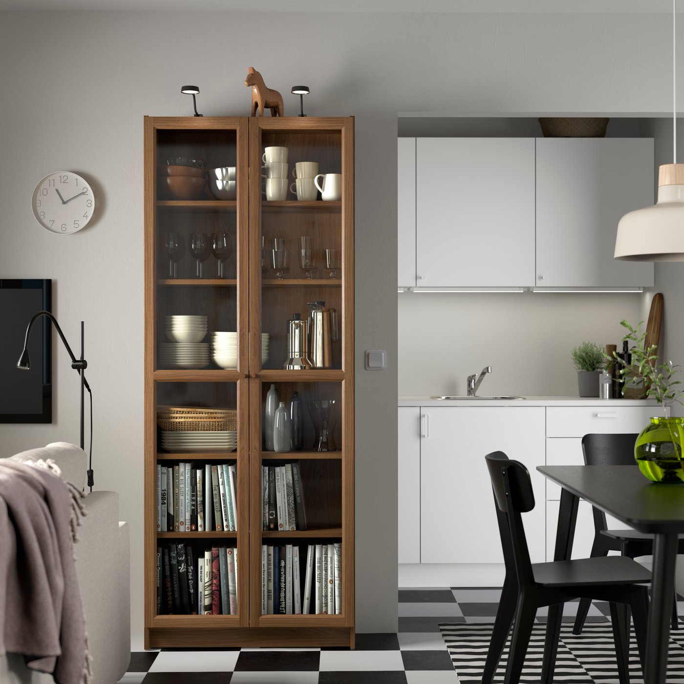 A brown walnut effect BILLY bookcase with glass doors