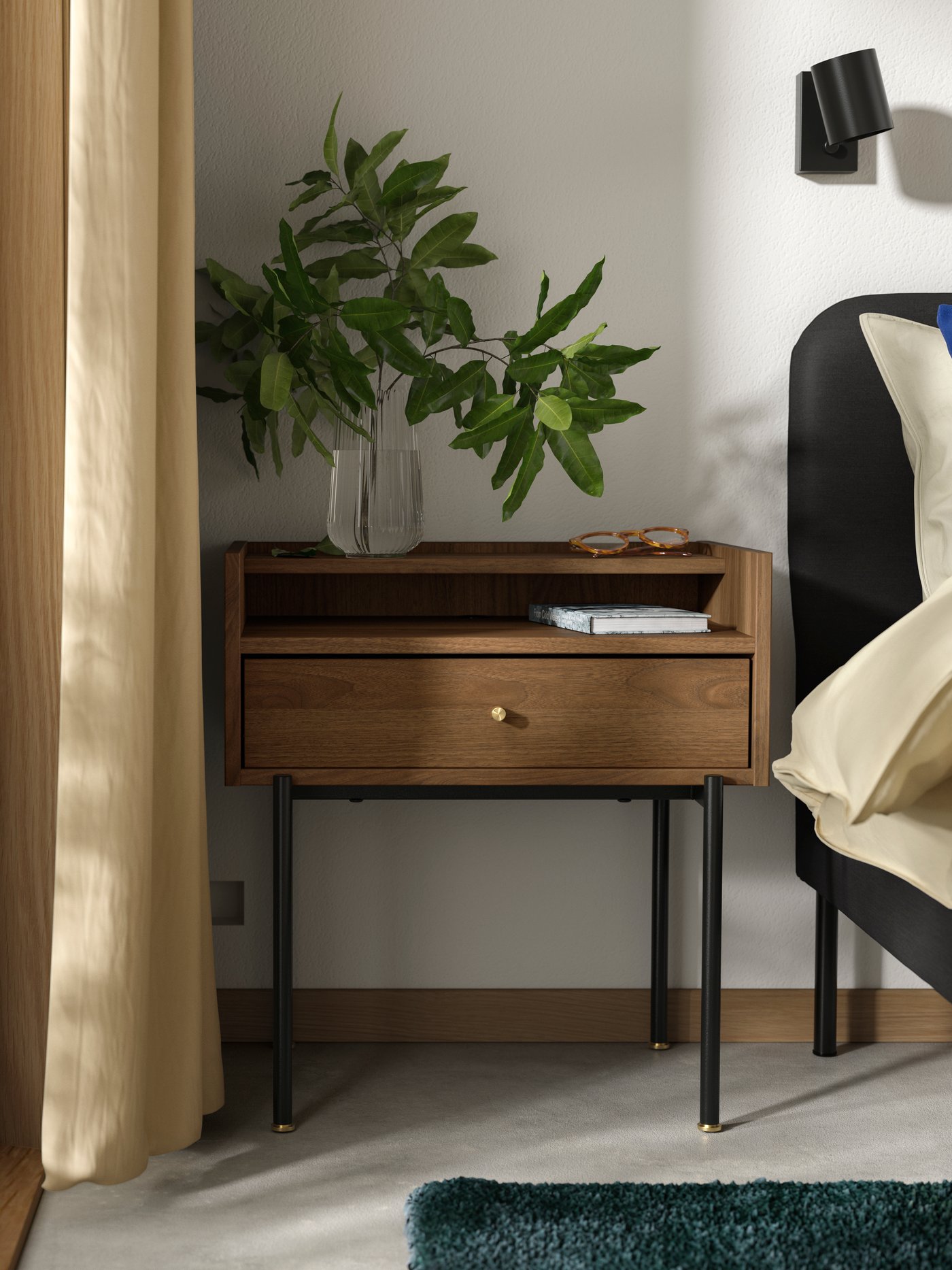 A brown walnut effect RÅDMANSÖ bedside table