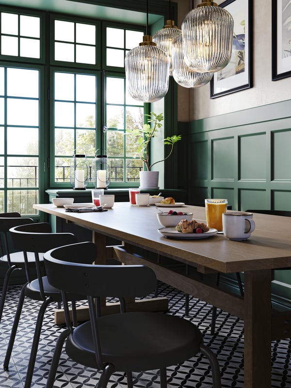 A brass/grey clear glass SOLKLINT pendant lamp