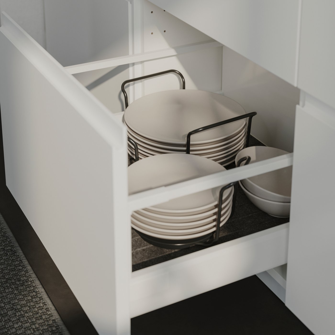 A matt white VOXTORP drawer front in the kitchen