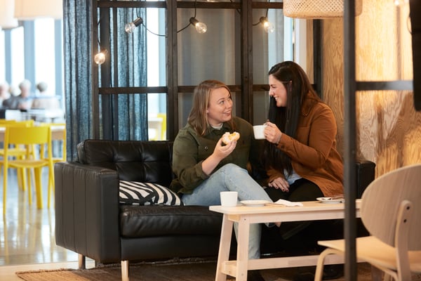Two women in the Swedish Restaurant drinking coffee.