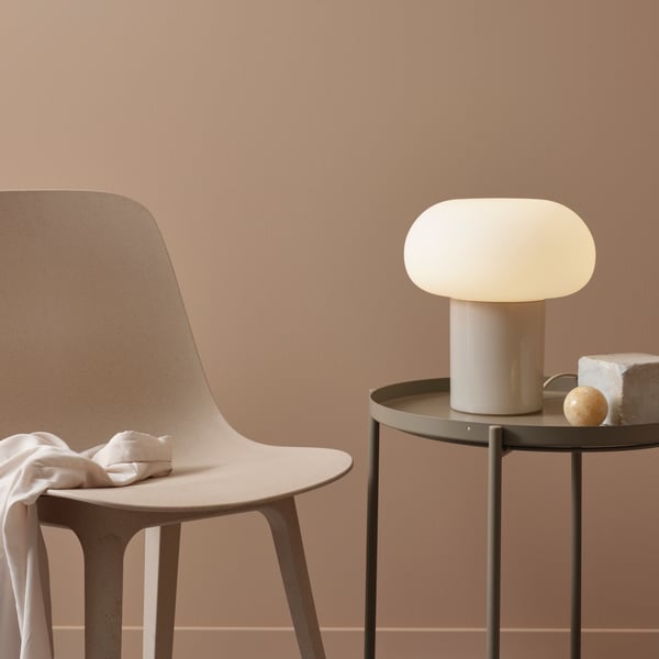A beige/opal white DEJSA glass table lamp