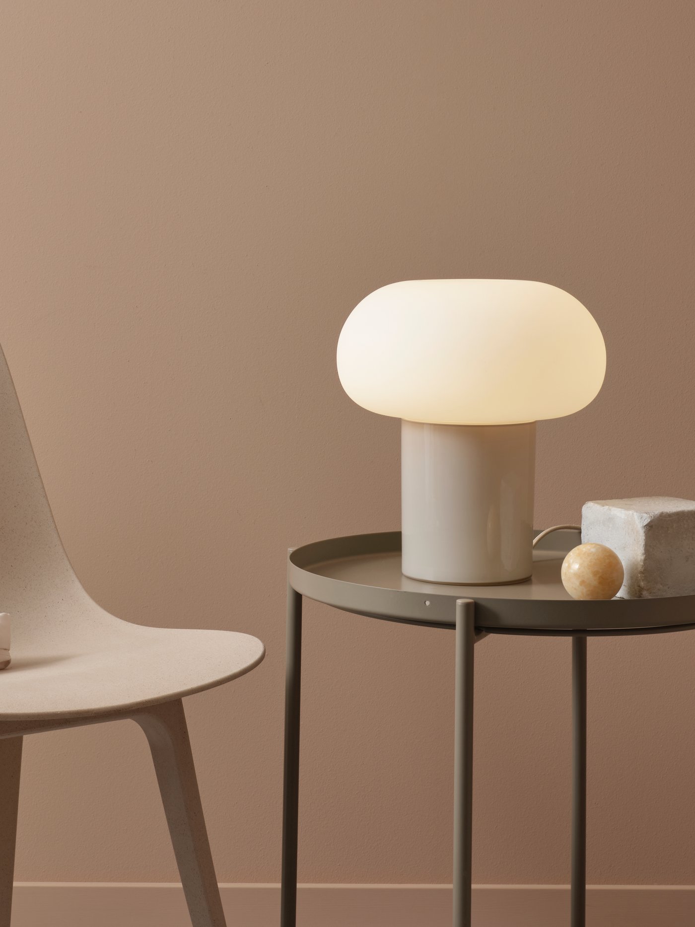 A beige/opal white glass DEJSA table lamp