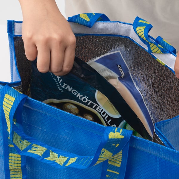 A blue FRAKTA cool bag