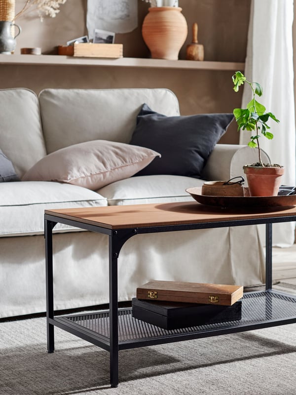 A black FJÄLLBO coffee table